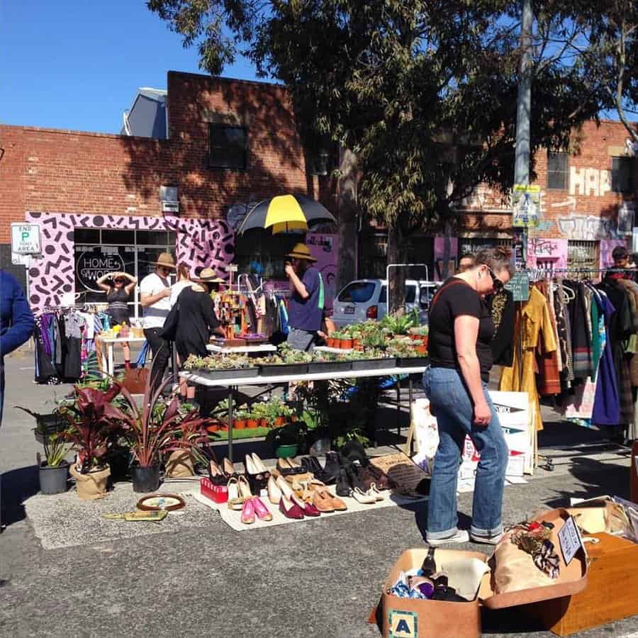 Pre-loved fashion and handprinted clothing at outdoor stalls at the Brunswick Community Flea Market