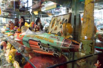 Antiques displayed in a window display at an antique mall