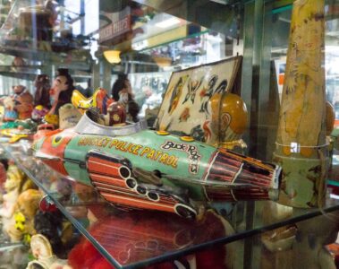 Antiques displayed in a window display at an antique mall